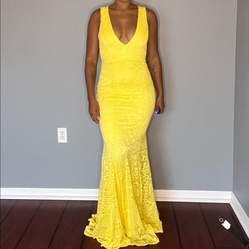This stunning yellow dress was only worn once.